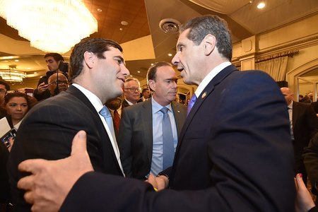Governor Andrew M. Cuomo delivers remarks at a meeting of the Long Island Association in Woodbury, Long Island in February. Jay Jacobs is at center.