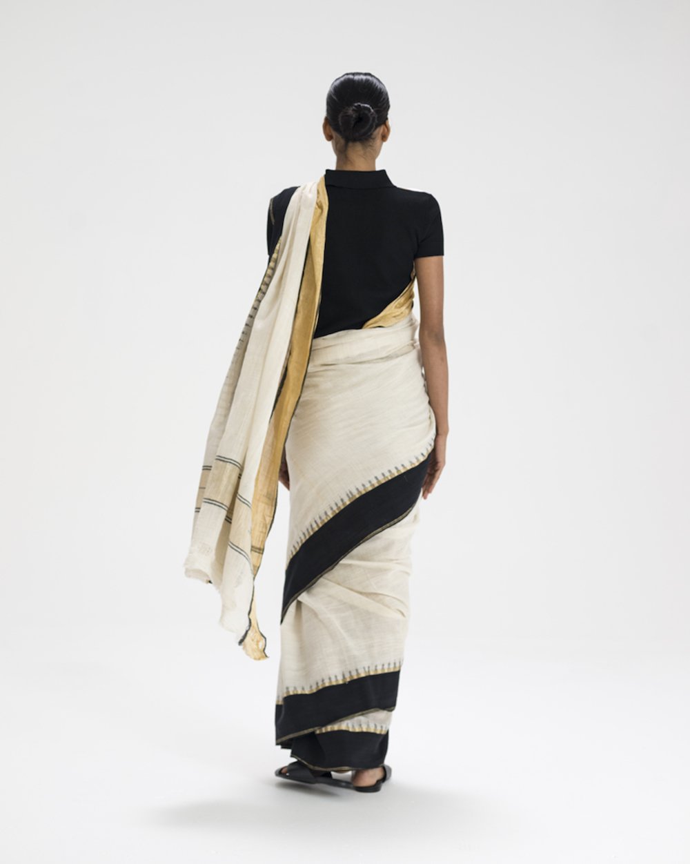 Model wearing a Mohiniattam sari drape with peplum pleats, a style from Kerala, by Taanbaan, part of The Sari Series: An Anthology of Drape, India, 2017. Photograph by Bon Duke. © Border&Fall
