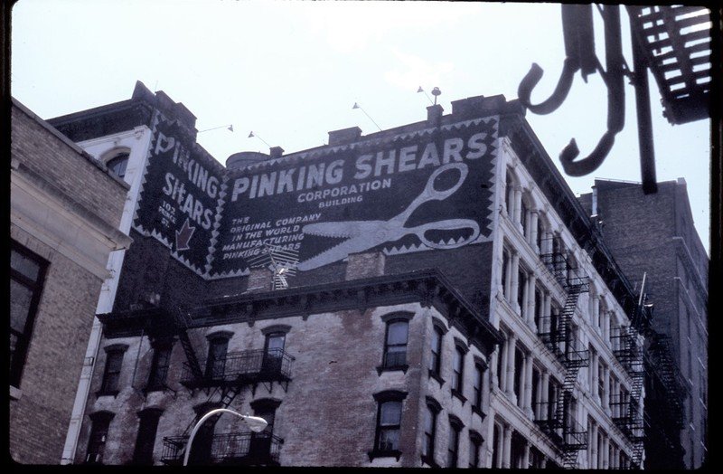674e370b4fc7a32ae01b3f0b6284244868799c752-jpg.jpeg Corner of Prince and Greene Streets, with Pinking Shears sign, now Apple Store, Louis Vuitton. Late 1980s.<br/>
