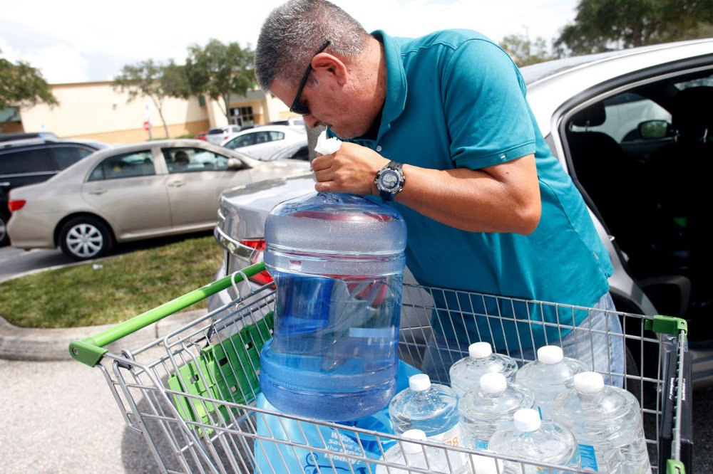 676e0220egettyimages-843059378-jpg.jpeg Carlos Otero, of St. Petersburg, loads his car with water bottles outside of a Publix grocery store as residents in the area prepare ahead of Hurricane Irma on September 05, 2017 in St. Petersburg, Florida (Getty Images)