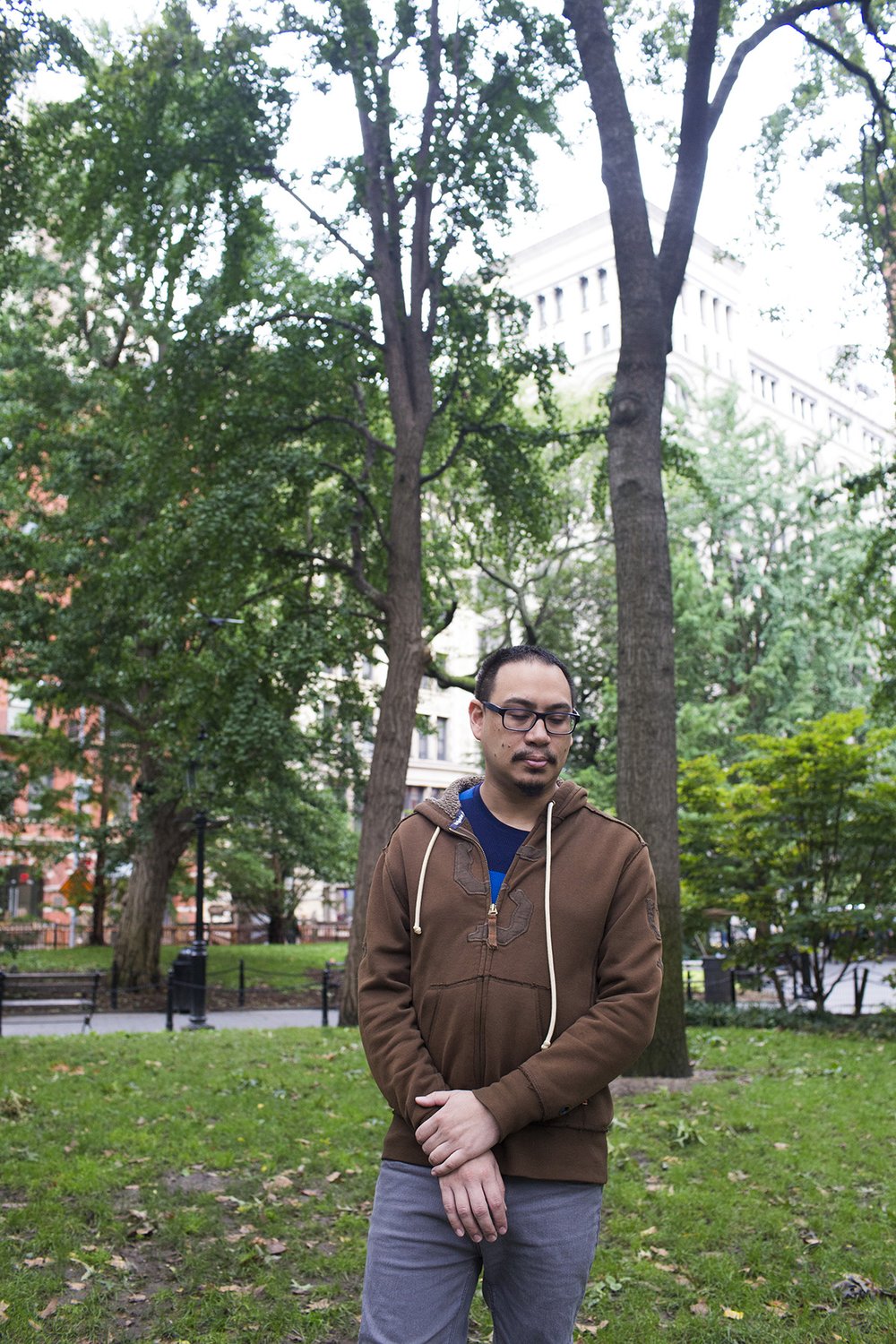 Dominick Guerrero, a candomble initiate and Tarot reader, poses for a portrait in Washington Square Park during the Pagan Pride Festival on Saturday, October 1, 2016.<br>