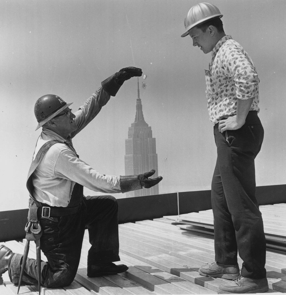 6aa44ae2f.jpeg Construction workers on the 59th floor of the Pan American Building in New York. The Empire State building is seen in the background, 1962.