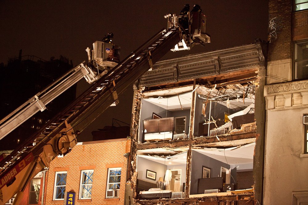 6adc2cc64gettyimages-154984433-jpg.jpeg Fire fighters evaluate the scene of an apartment building which had the front wall collapse due to Hurricane Sandy on October 29, 2012 <br/>