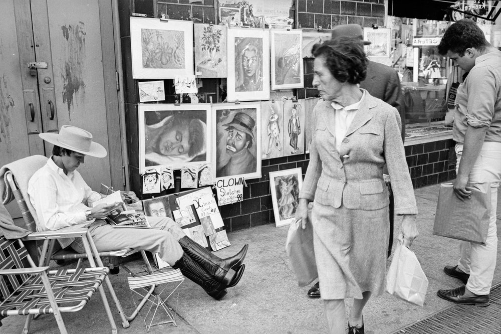 6b23a6a24.jpeg "Paintings on display in Washington Square in Greenwich Village. Artists traditionally exhibit their work on the area's streets in spring and autumn. October 1964."
