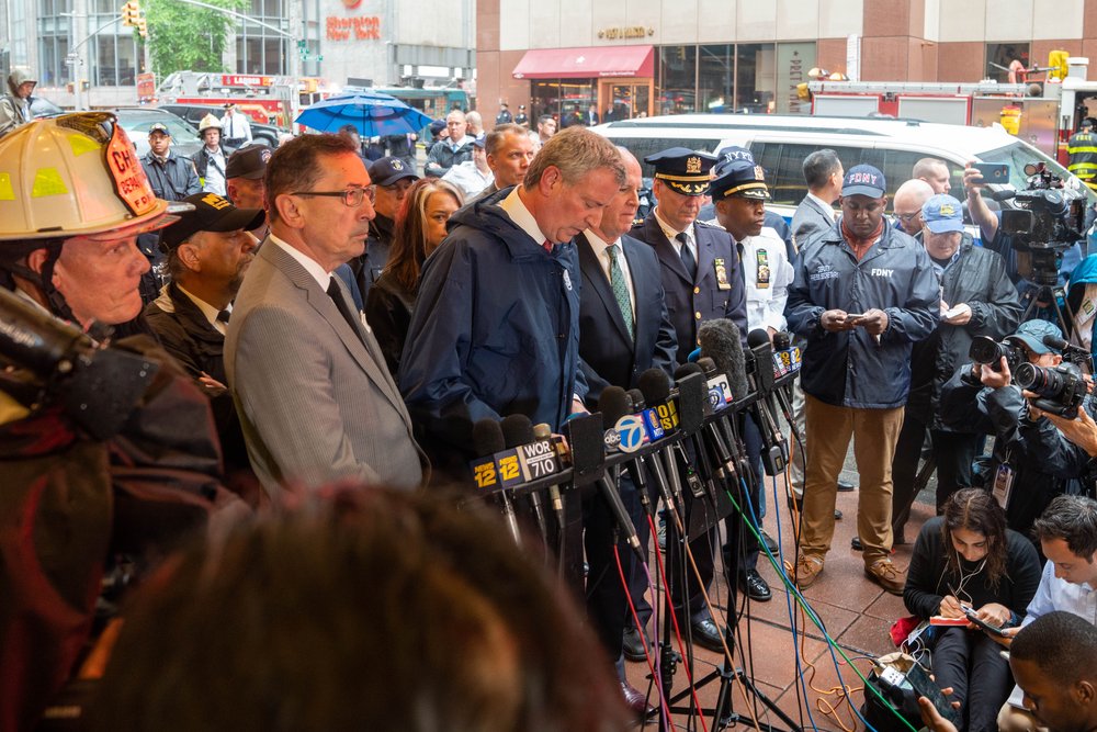 The mayor with fire and police officials (David "Dee" Delgado /  Gothamist)