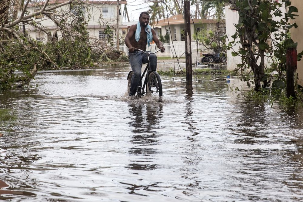 6da74b36b092517gettypuertorico-jpg.jpeg A man rides a bike through high water in Loiza, Puerto Rico, on Friday, September 22. (Alex Wroblewski/Getty Images)