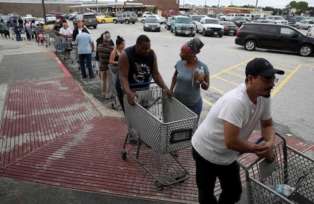 71395cf56gettyimages-840932928-jpg.jpeg People line up to buy groceries in the Chanelview section of Houston as flood waters began to recede following Hurricane Harvey August 29, 2017.<br>