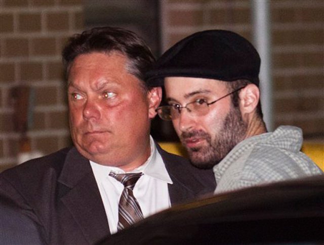 71411dis1.jpg Accused killer Levi Aron yesterday in custody