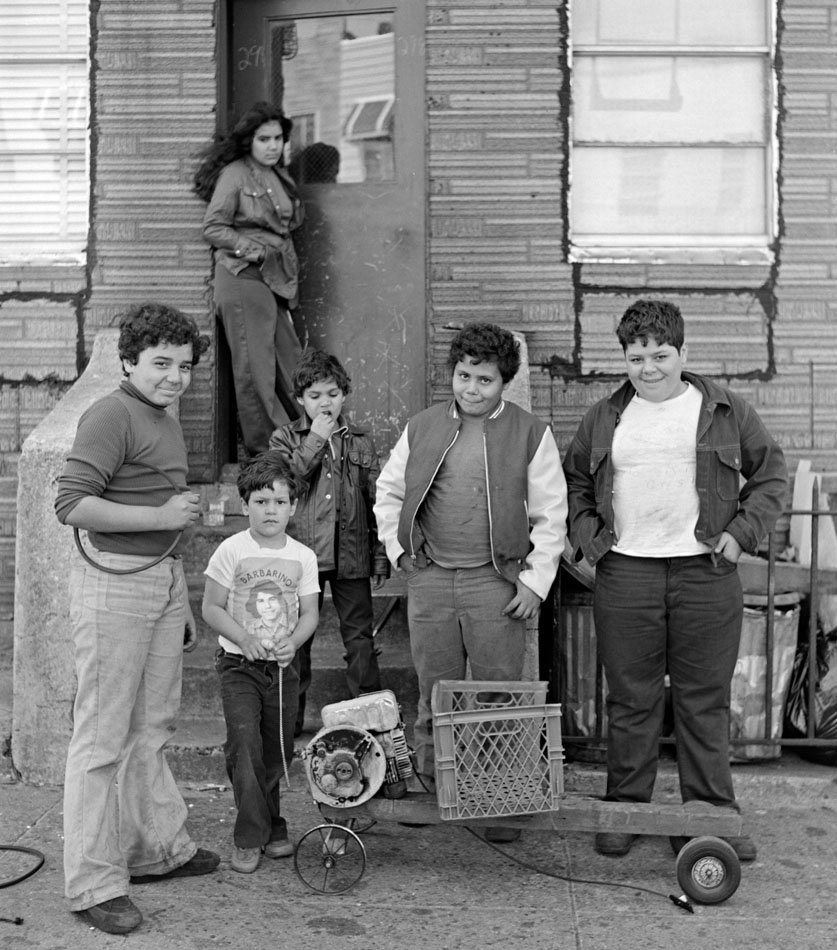 7f68afaf0boys-with-homemade-go-cart-15th-street-1977-jpg.jpeg Boys with homemade go carts on 15th Street, 1977.<br/>