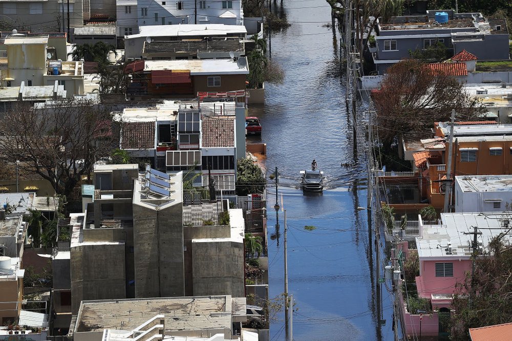 8573a0897gettyimages-853695512-jpg.jpeg : A flooded street is seen as people deal with the aftermath of Hurricane Maria on September 25, 2017 in San Juan Puerto Rico.