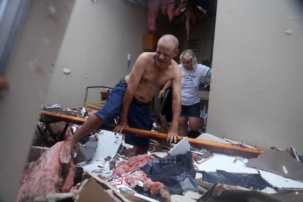 876f8b387gettyimages-839556542-jpg.jpeg Billy Raney and Donna Raney climb over the wreckage of whats left of their apartment after Hurricane Harvey destroyed it on August 26, 2017 in Rockport, Texas<br>