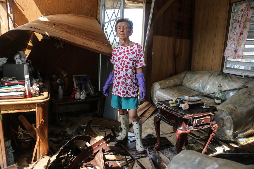 87e67742fgettyimages-860364972-jpg.jpeg Sonia Torres, 60, poses in her destroyed home while taking a break from cleaning, three weeks after Hurricane Maria hit the island, on October 11, 2017 in Aibonito, Puerto Rico. <br/>