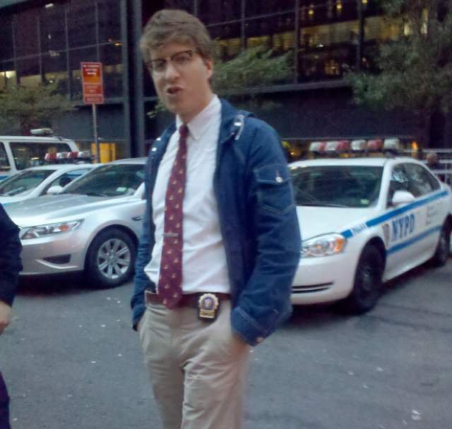 Hipster Cop in the photo that Started It All. (<a href="http://twitpic.com/6yht6">Lucy Kafanov's Twitter</a>).