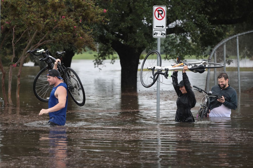 890ddcba6gettyimages-839979018-jpg.jpeg Residents navigate a flooded street that has been inundated with water from Hurricane Harvey on August 27, 2017 in Houston, Texas<br>