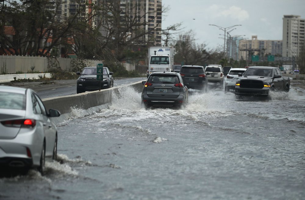 8aaf4e083092517gettypuertorico8-jpg.jpeg Vehicles drive along a flooded road after Hurricane Maria passed through the area on Saturday, September 23rd in San Juan, Puerto Rico. (Joe Raedle/Getty Images)