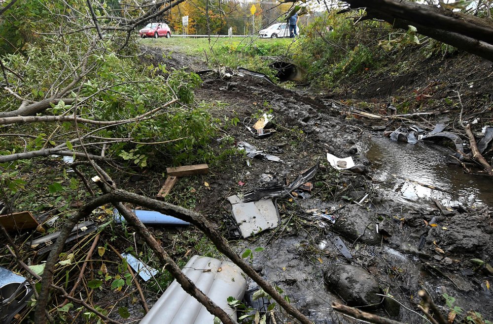 8d9ce8f66shutterstock_9916971d-jpg.jpeg Debris scatters an area, at the site of yesterday's fatal crash Schoharie, N.Y. (Hans Pennink/AP/Shutterstock)