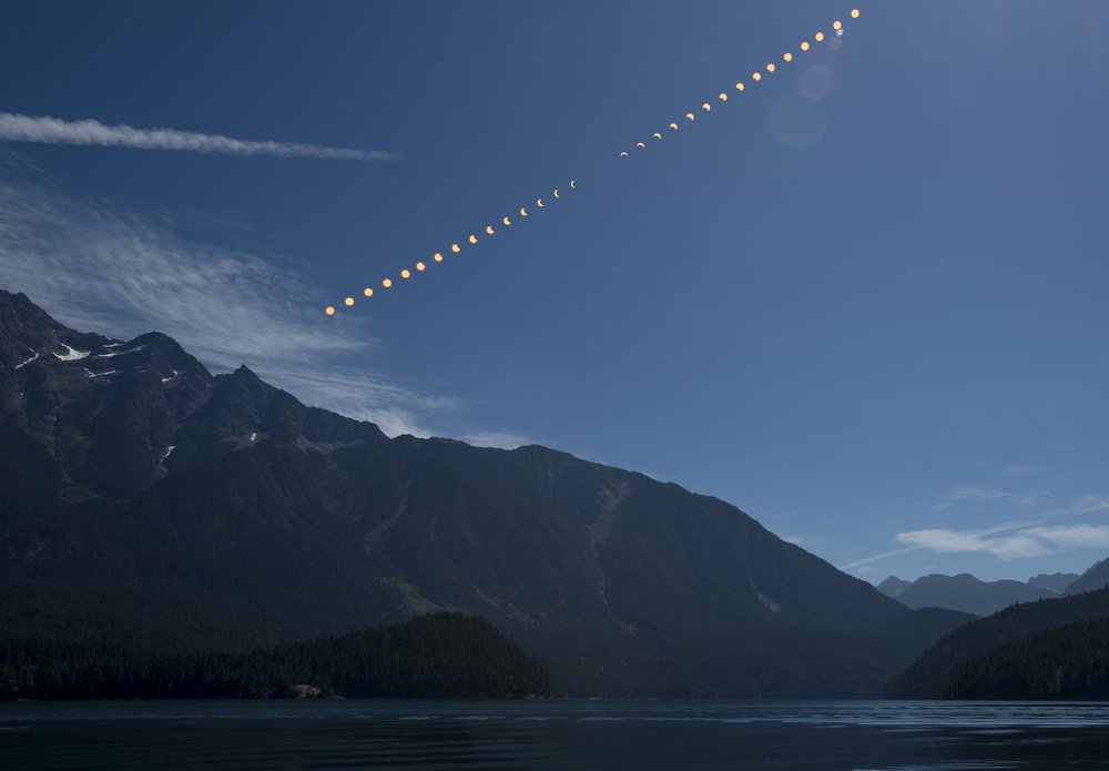 9285ebfd1082217moon3-jpg.jpeg This composite image shows the progression of a partial solar eclipse over Ross Lake, in Northern Cascades National Park, Washington