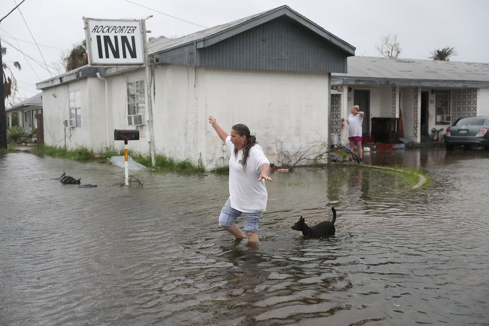 95dc312e3gettyimages-839559412-jpg.jpeg Valerie Brown walks through a flooded area after leaving the apartment that she road out Hurricane Harvey in on August 26, 2017 in Rockport, Texas<br>