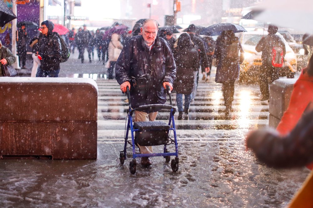 96f6fcb83shutterstock_9981128e-jpg.jpeg A man uses his walker in Times Square (Vanessa Carvalho/Shutterstock)
