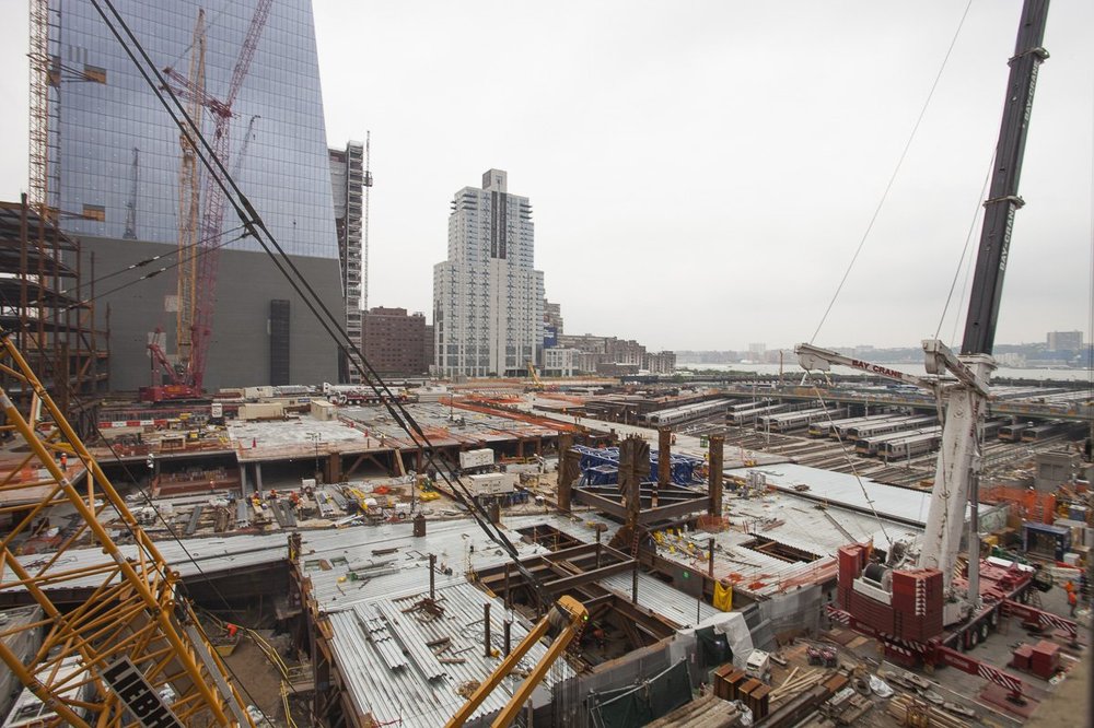 This is looking out over the East section of the yard, looking south.  You can see the MTA train tracks peeking out from under the massive deck being built over them at the right side of the picture.  And lots of cranes!<br/>