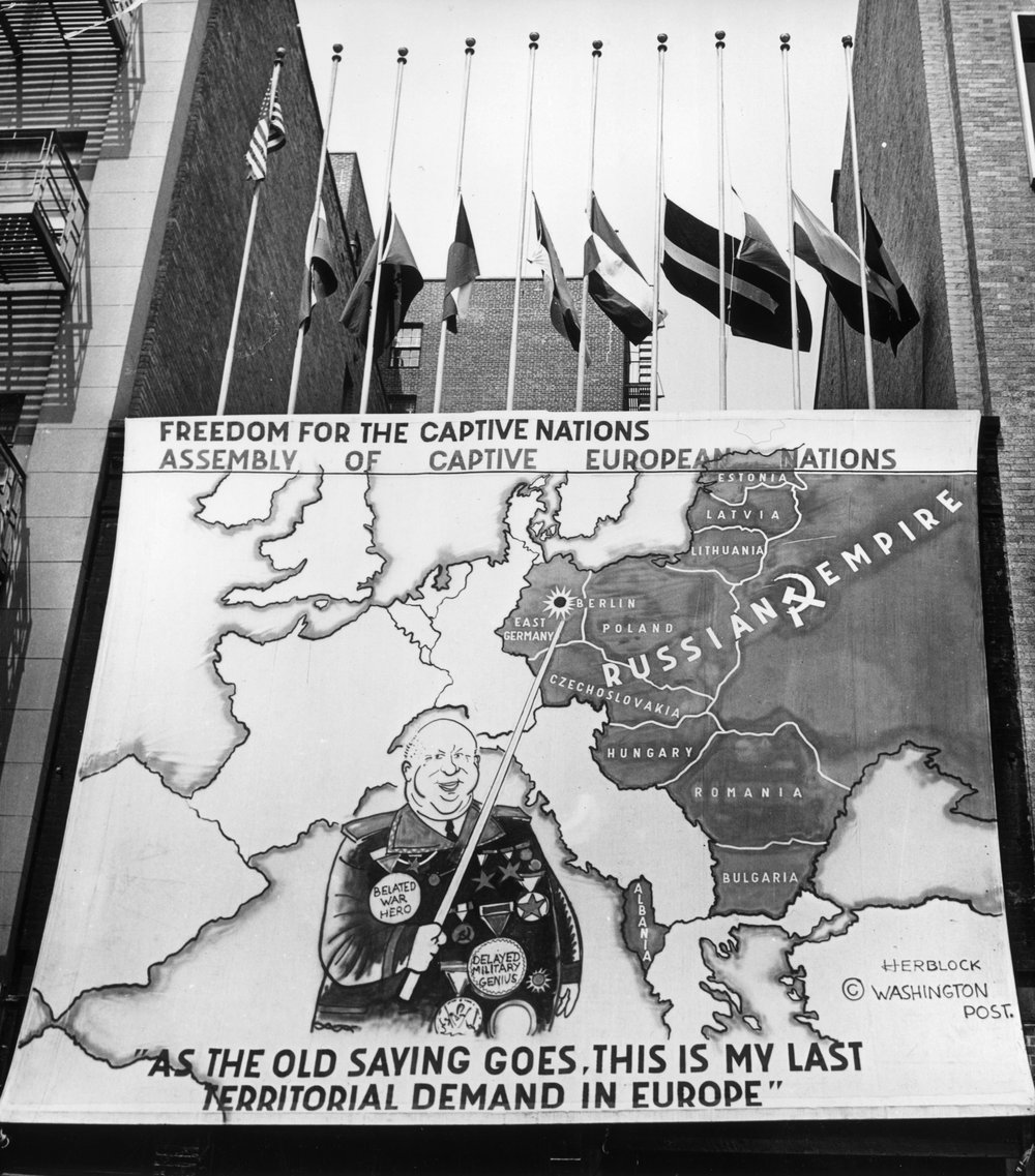 97b58f12b.jpeg "A poster which blames Khrushchev for his attack on Berlin set up on a house across from the UN building in New York. Underneath a caricature of Khrushchev it says 'As the old saying goes, this is my last territorial demand in Europe.' Aug 1961"