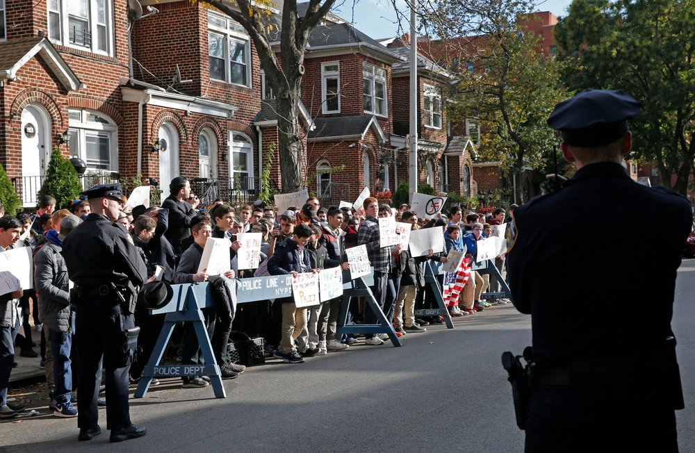 Protesters outside Jakiw Palij's home in Jackson Heights, Queens, November 2017 (AP/Shutterstock)