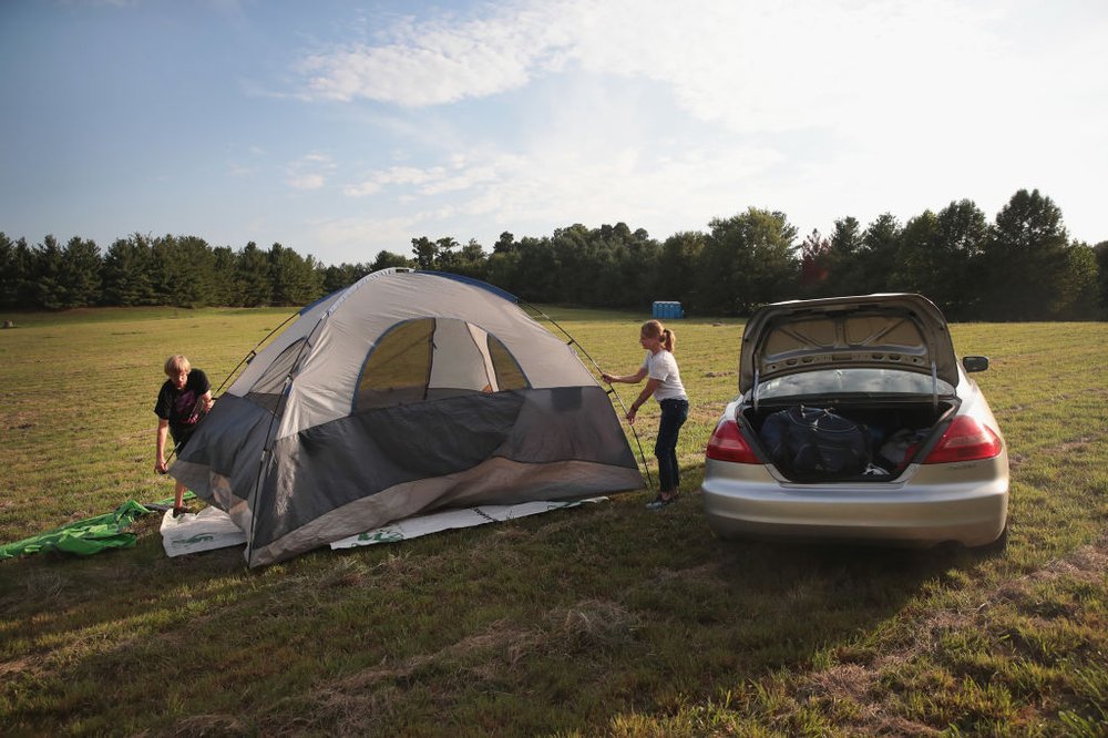 99cdc4670gettyimages-835330752-jpg.jpeg Karen Just and her son Mathew pitch a tent in a hay field which had been converted into a campground to host visitors for Monday's solar elclipse on August 18, 2017 near Carbondale, Illinois. With approximately 2 minutes 40 seconds of totality the area in Southern Illinois will experience the longest duration of totality during the eclipse. <br>