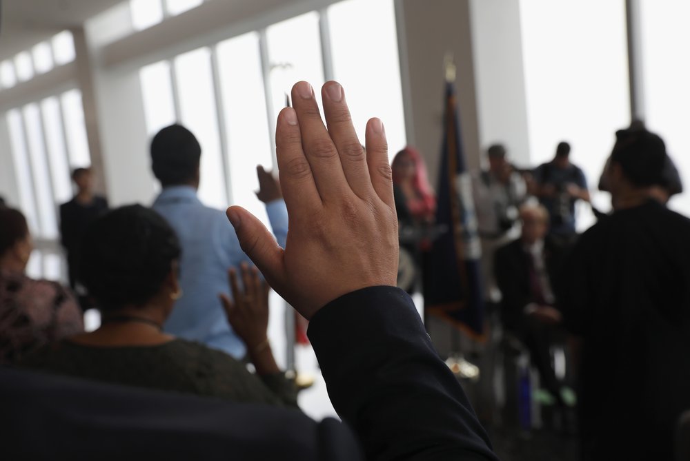 9b48bc3aagettyimages-831851956-jpg.jpeg Immigrants take the oath of allegiance to the United States at a naturalization ceremony held in the observatory of the One World Trade Center on August 15, 2017 in New York City<br>