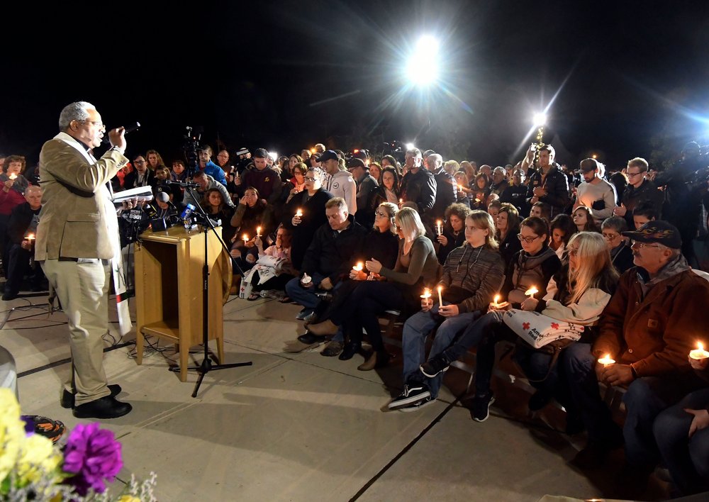 9c789a5f7shutterstock_9918686e-jpg.jpeg Rev. Kent McHeard speaks to family members and friends during a candlelight vigil memorial at Mohawk Valley Gateway Overlook Pedestrian Bridge in Amsterdam, N.Y.<br>