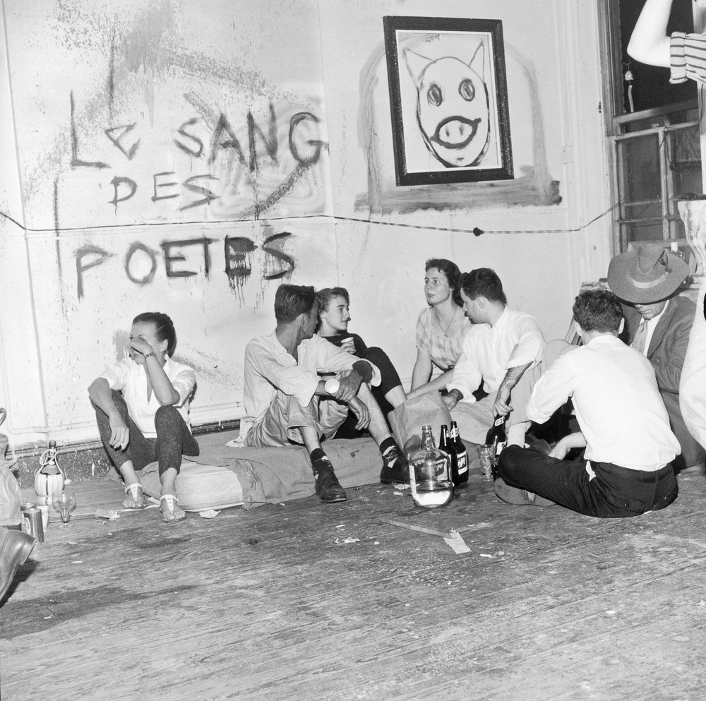 9d3da51acfredwmcdarrah_p054-jpg.jpeg Guests sit on a mattress and on the floor at a birthday party for Ted Joans, July 25, 1959 Vintage gelatin silver print, printed ca. 1959<br/>