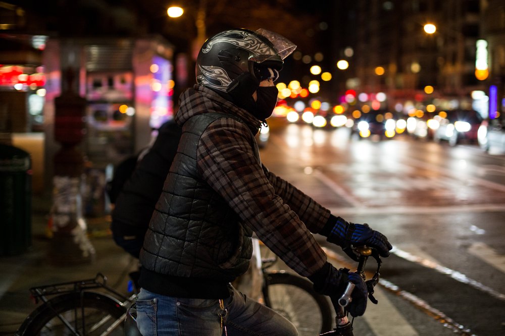 9effc55c52018-01-13_heinsebikedigital-8-jpg.jpeg The temperature, which was hovering around freezing, dips into the low twenties and teens. Zhu wears two pairs of long johns underneath his jeans, and two coats. “It gets so cold that my shoes don’t keep me warm, so we go to the basement and use plastic bags to cover our socked feet."