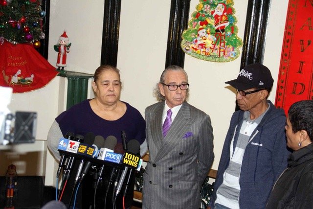 9f08f3b00lawsuit-3-jpeg.jpeg Attorney Sanford Rubenstein (center) is joined by the mother and father of shooting victim Irene Urena Perez. (Photo by David Greene / Gothamist)
