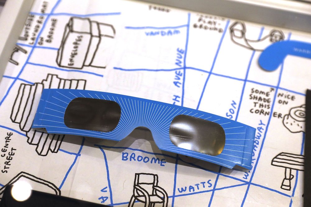 9f6fa797cgettyimages-830380350-jpg.jpeg A pair of free solar eclipse glasses sit on display at a Warby Parker store on August 11, 2017 in New York City. <br>