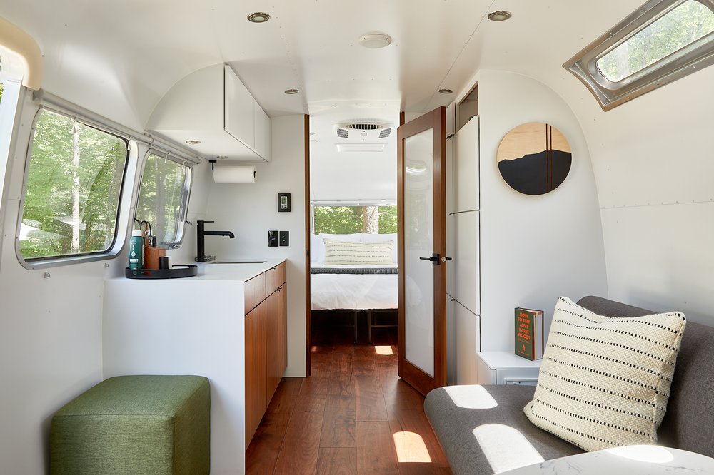 The interior of an Airstream used for glamping.