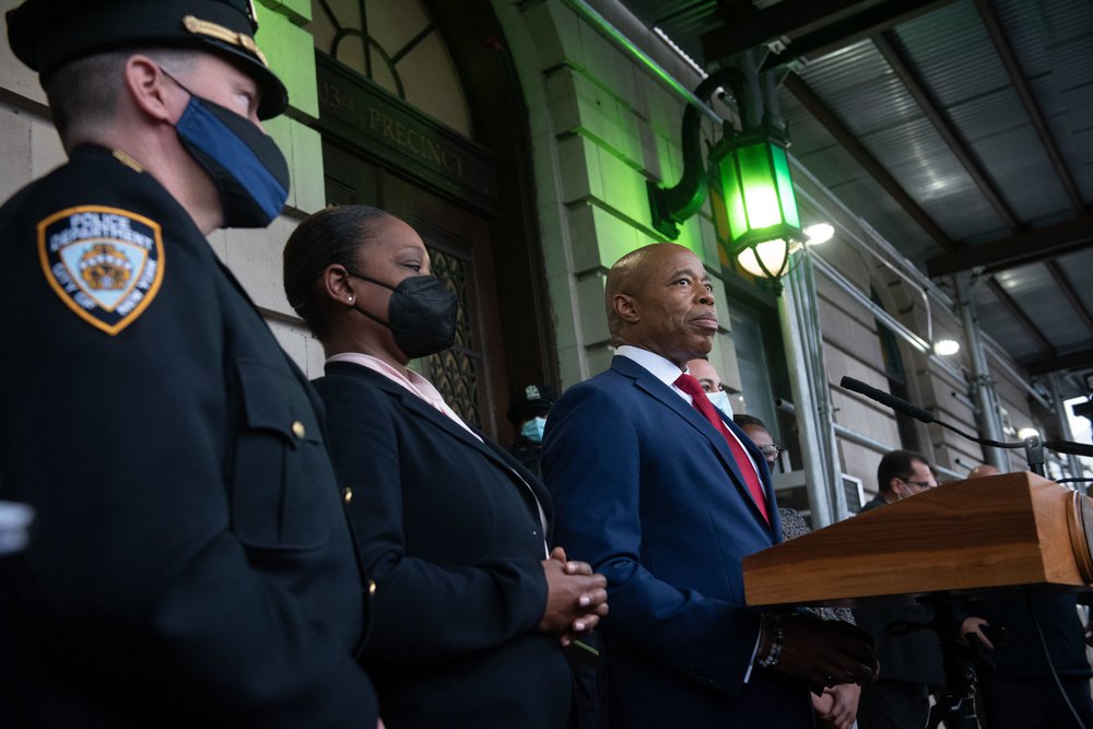 New York City Mayor Eric Adams stands with Police Commissioner Keechant Sewell as they lead roll call at the 103rd NYPD Precinct in Queens