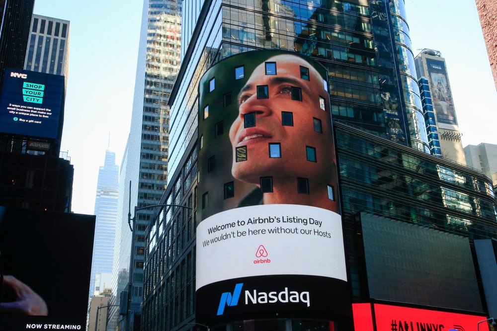 A stock photo of Airbnb ad on Nasdaq exchange