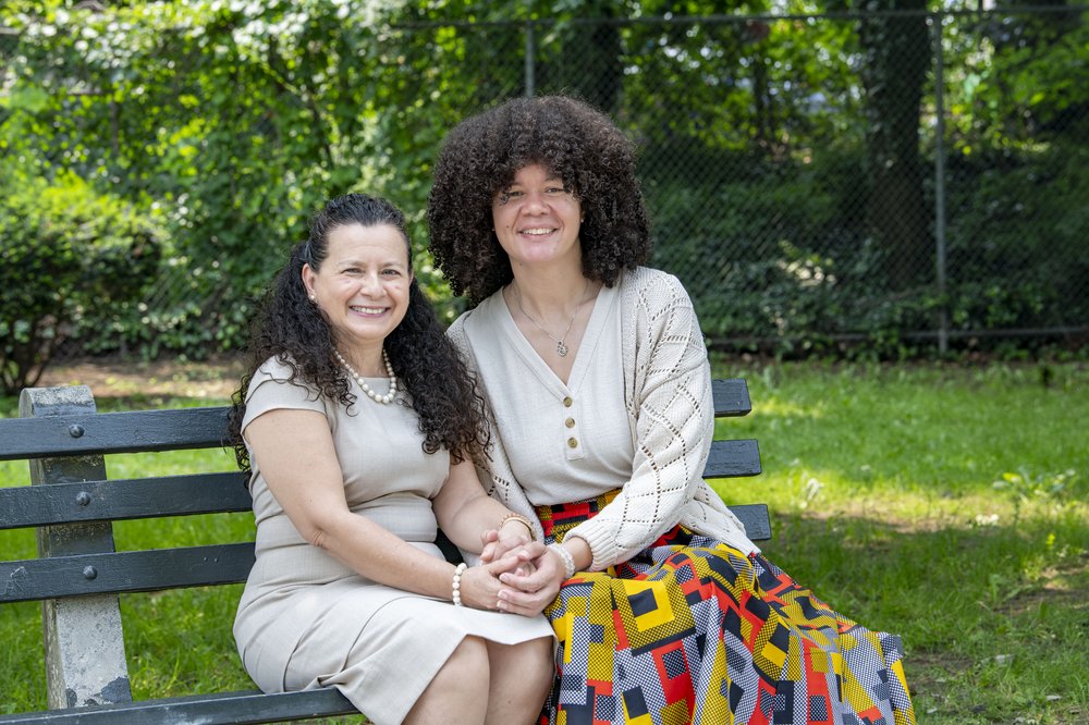 Aisha Wilson (right) and her therapist Edith Salmeron sit together in a New York City park.