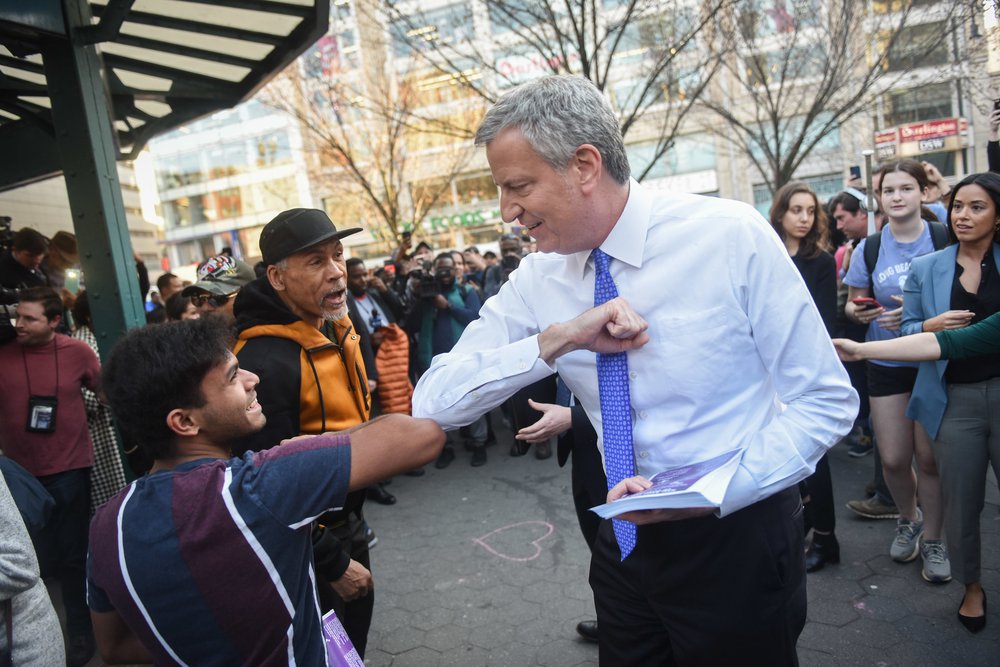 Mayor Bill de Blasio hands out fliers regarding COVID-19 preparedness in Union Square on Monday, March 9, 2020.