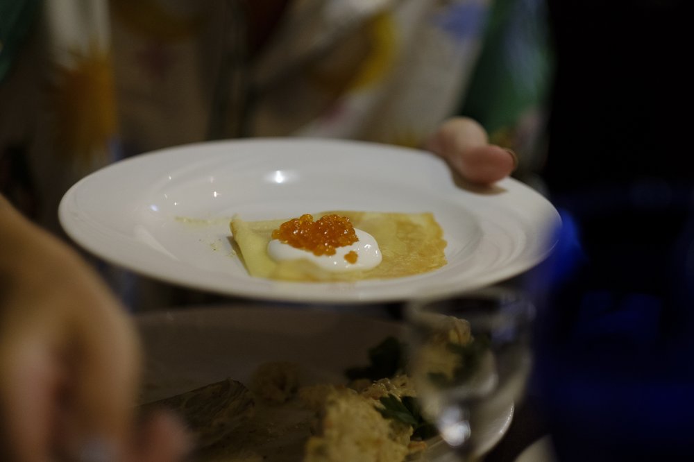 Red vaciar atop a small crepe.