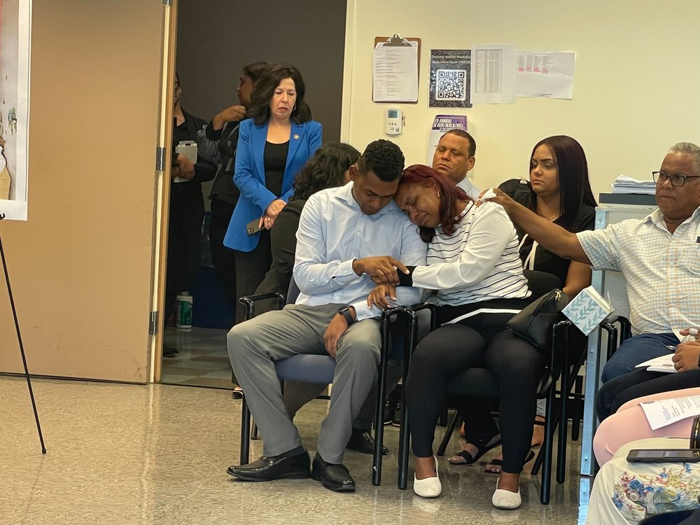 Otoneil Feliz and Zoila Dominici, parents of Nicholas Dominici, comfort each other at a press conference in the Bronx DA’s office.