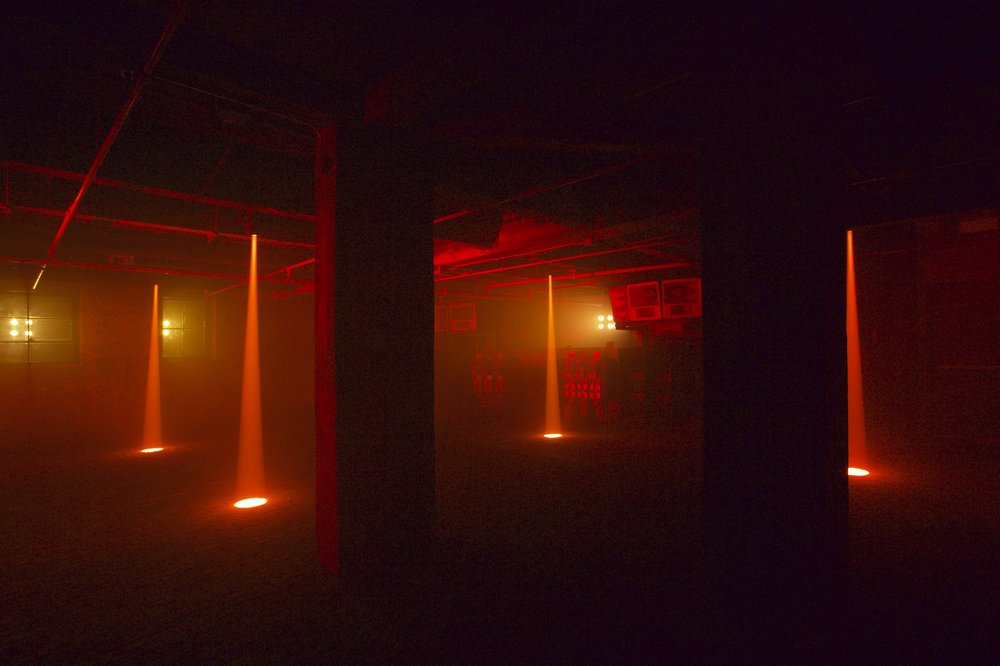 A dark room with a red glow.