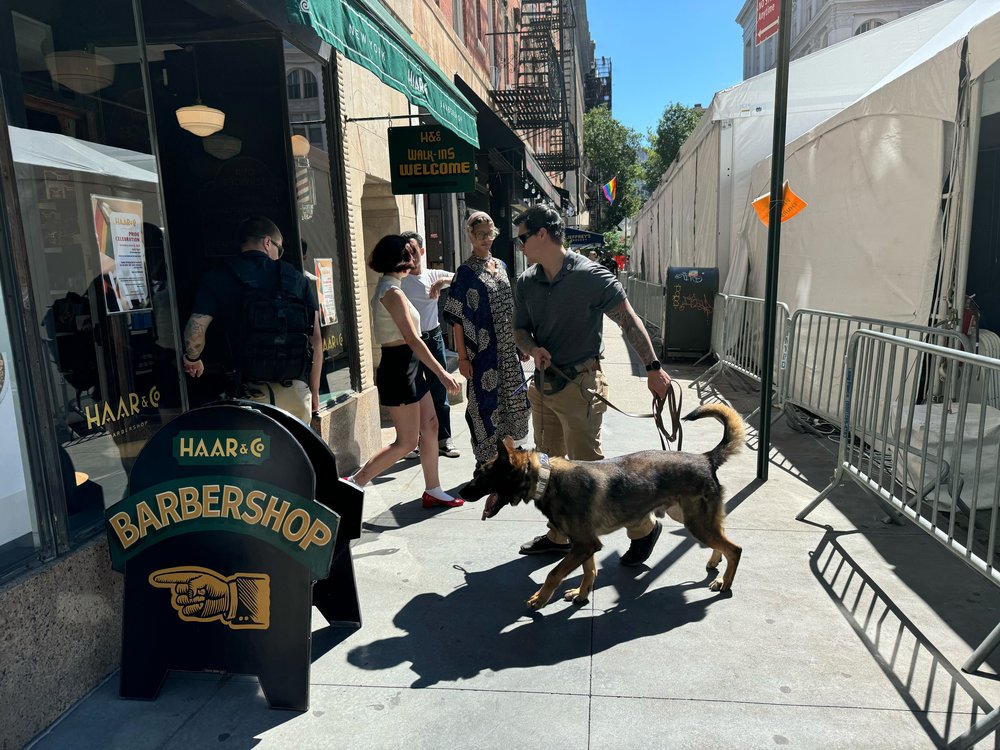 A photo of Secret Service officials sweeping the area President Biden is expected to visit.