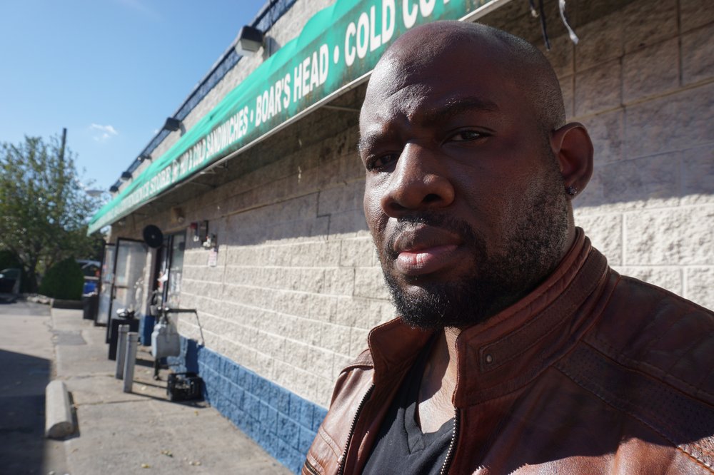 Officer Murashea Bovell standing in front of a gas station in Mount Vernon’s south side last November.