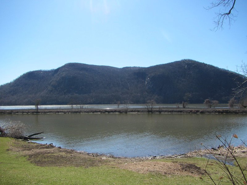 A mountain with a blue sky in the backround