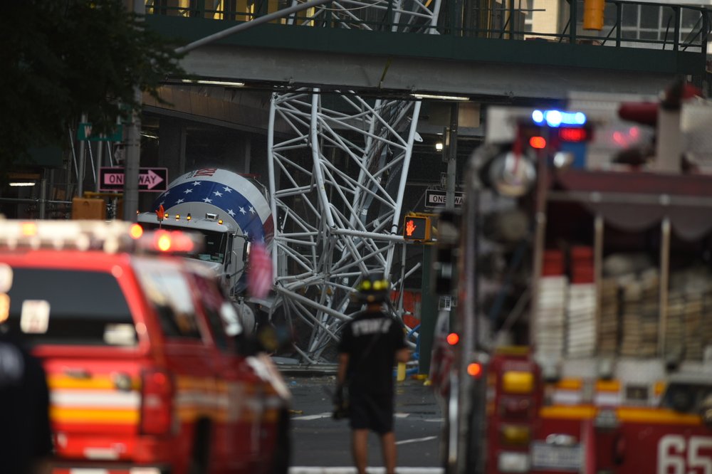 A photo of twisted metal sent hurtling to the street after a crane collapse Wednesday