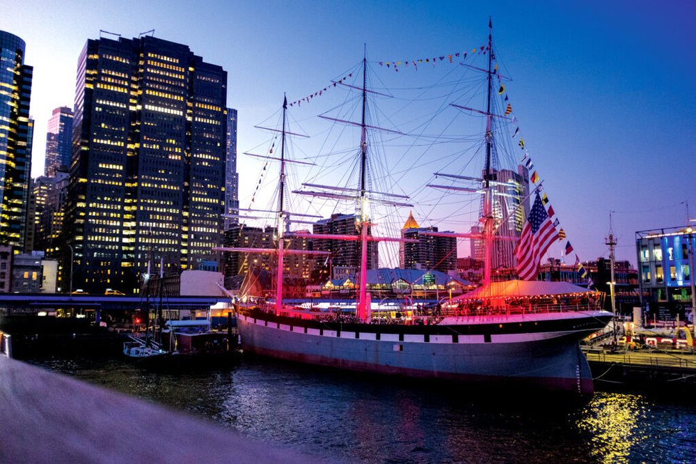 An old fashioned ship in the water in New York City.