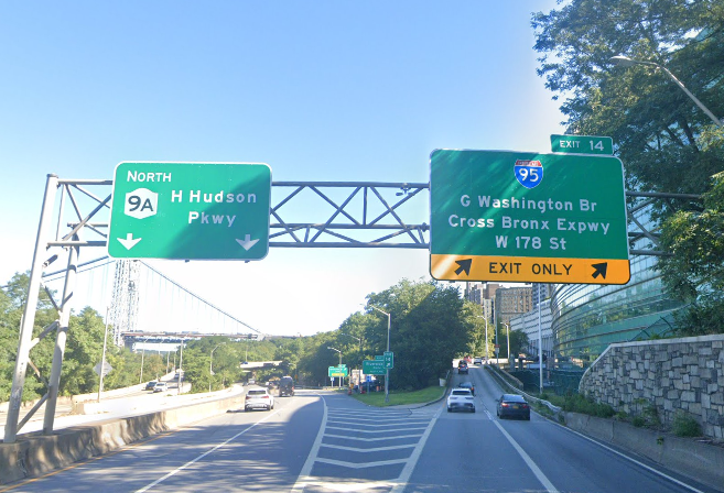 A green highway exit sign.