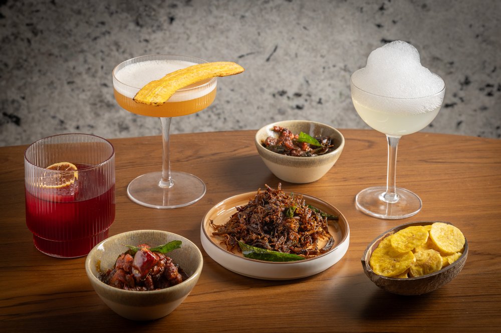 Plates and drinks on a wooden table.