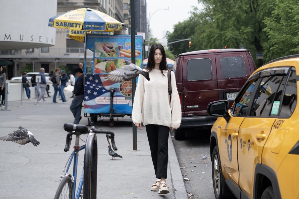 A woman outside with a cab