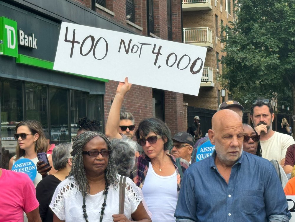 Clinton Hill neighbors mount protest Tuesday night against a complex of shelters for migrants in their neighborhood. The complex near the Brooklyn Navy Yard serves some 4,000 migrants, mostly asylum-seekers. The neighbors say that's too many for one location.